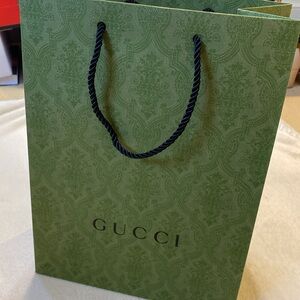 GUCCI empty brocade paper shopping bag with black rope handles. Pristine
